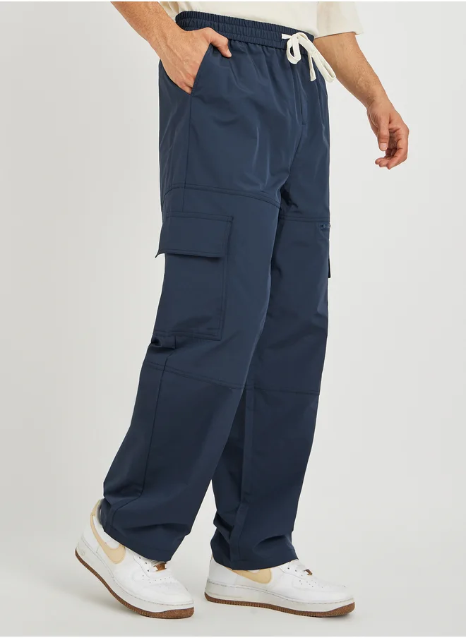 ستايلي Styli Men Navy Blue Solid Oversized Open Hem Cargo Joggers with Zipper Pockets