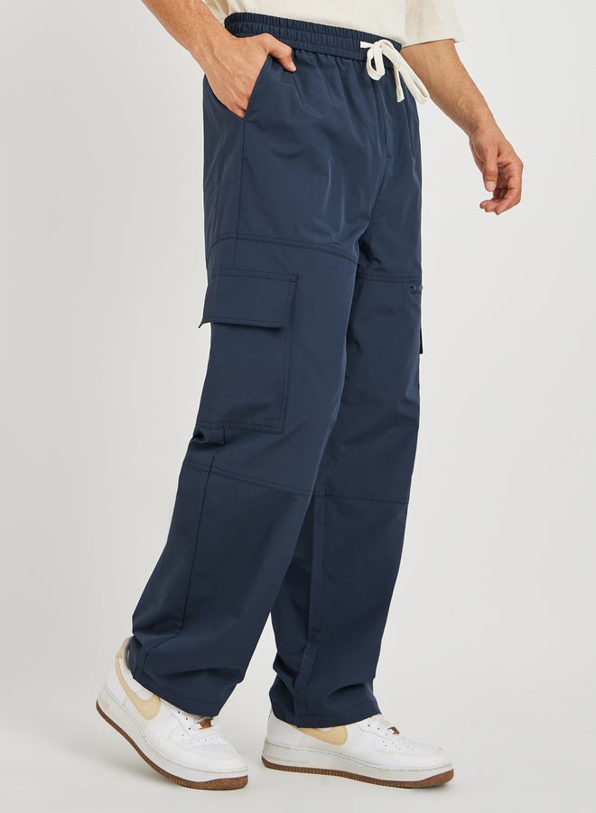 Styli Styli Men Navy Blue Solid Oversized Open Hem Cargo Joggers with Zipper Pockets  - Image 1