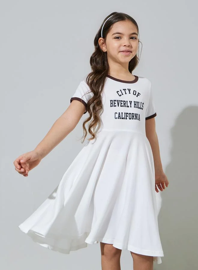 Styli Girls Off White Slogan Print Contrast Trims Knee Length T-Shirt Dress