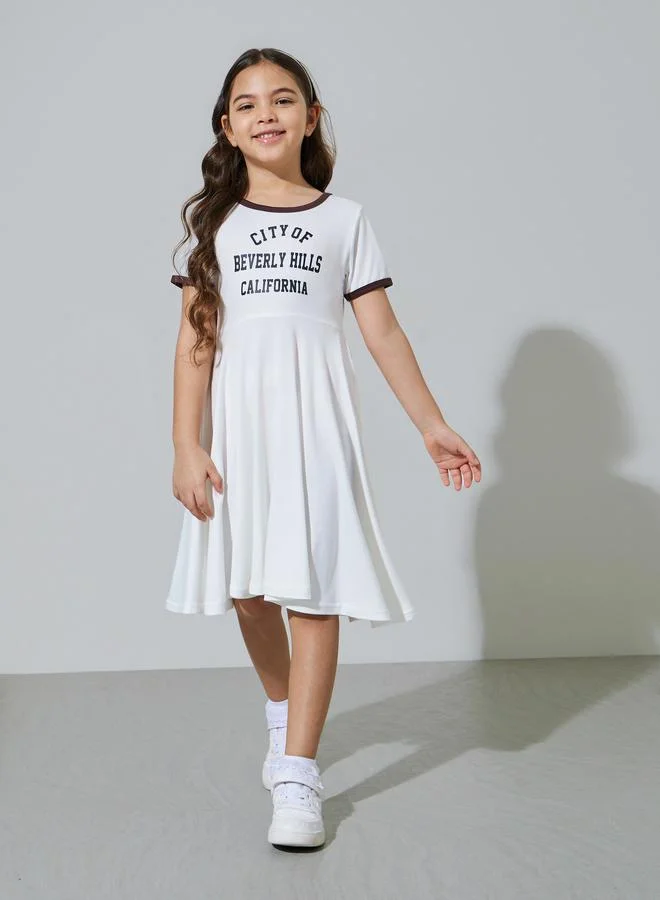 Styli Girls Off White Slogan Print Contrast Trims Knee Length T-Shirt Dress