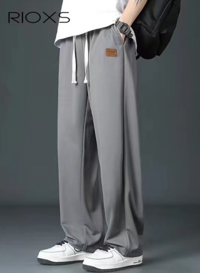 ريوكس بنطال رياضي رجالي، بنطال رياضي فضفاض من الحرير الجليدي مع جيوب جانبية، بنطال جري مريح بخصر مطاطي ورباط، بنطال كاجوال مستقيم واسع الساقين ومقاوم للتجعد، بنطال رياضي جاهز للصالة الرياضية، بنطال رياضي سريع الجفاف للأنشطة الترفيهية والخارجية، رمادي - Image 1