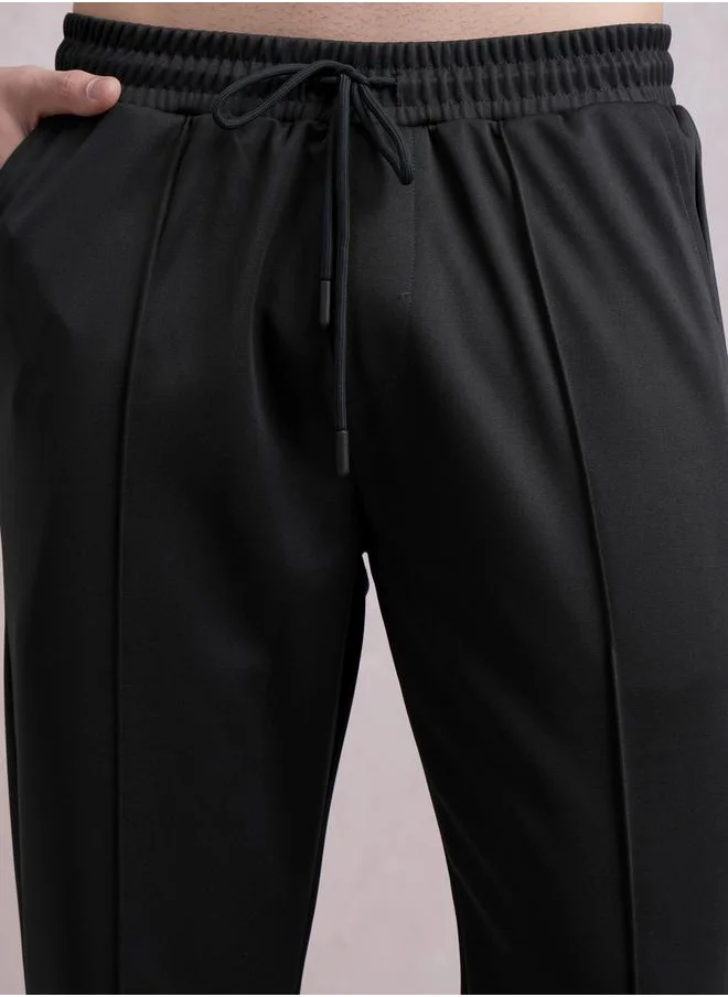 HIGHLANDER Solid Straight Fit Mid Rise Track Pants by Styli
