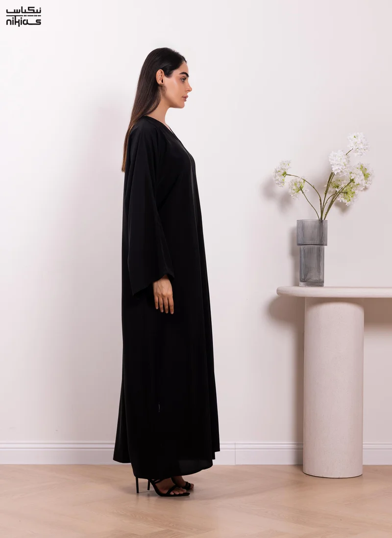 نيكياس Nikias Elegant plain Nida fabric abaya with full front buttons