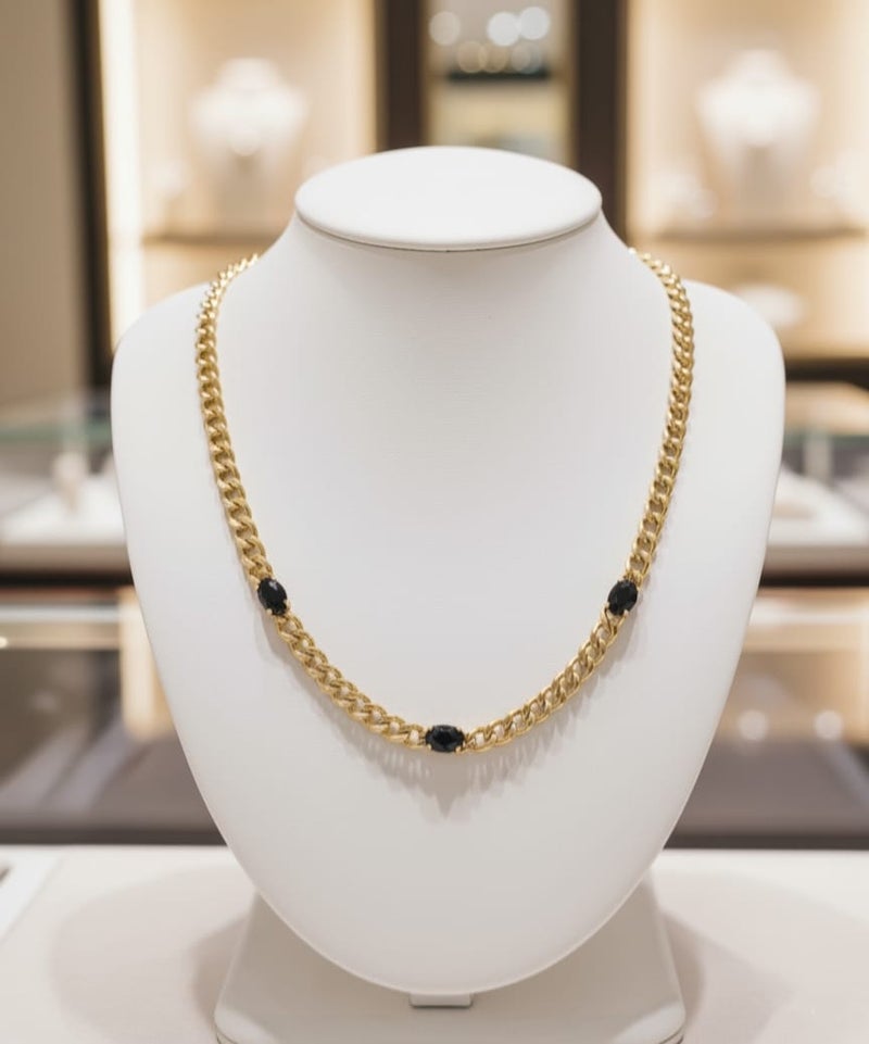 An elegant gold necklace with a distinctive thick chain, adorned with three oval-shaped black stones. Made of rust-resistant stainless steel with an adjustable clasp. - Image 4