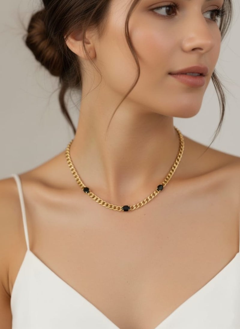 An elegant gold necklace with a distinctive thick chain, adorned with three oval-shaped black stones. Made of rust-resistant stainless steel with an adjustable clasp. - Image 2