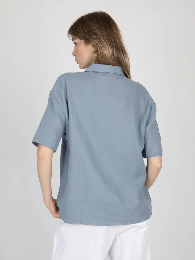 زوبعة قميص بأكمام قصيرة وجيب