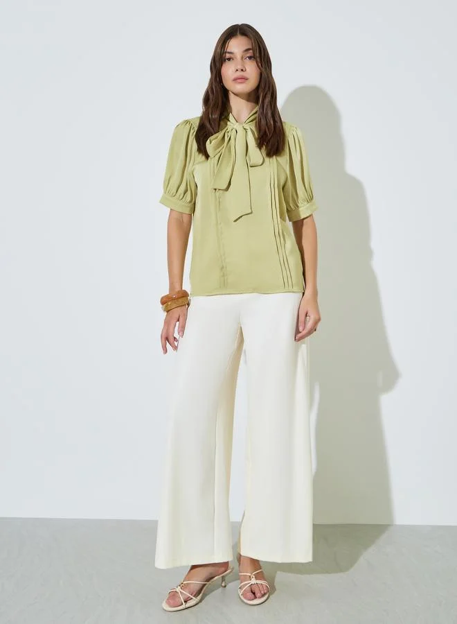 Styli Green Solid Tie-Up Neck Blouse With Pintuck Detail