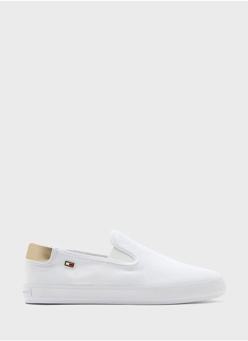 تومي هيلفيغر VULCANISED CANVAS SLIP ON TRAINERS
