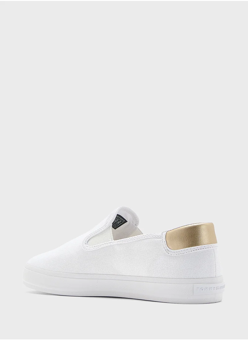 تومي هيلفيغر VULCANISED CANVAS SLIP ON TRAINERS