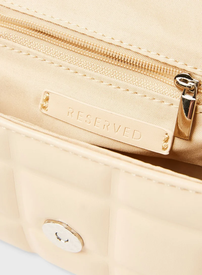 Reserved Embossed Crossbody Bag