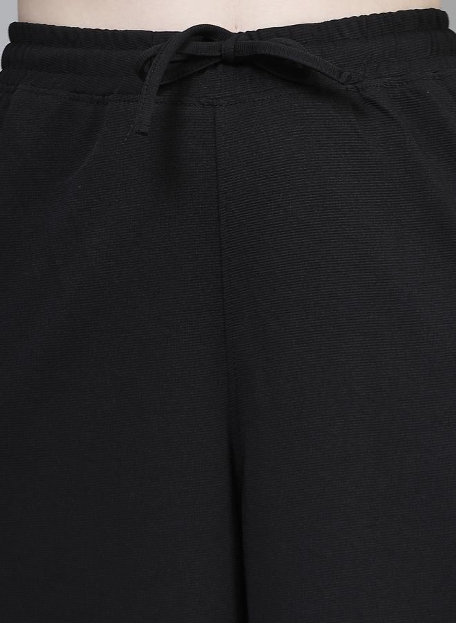 بوز بنطلون نسائي واسع الساق بخصر برباط أسود سادة - Image 5