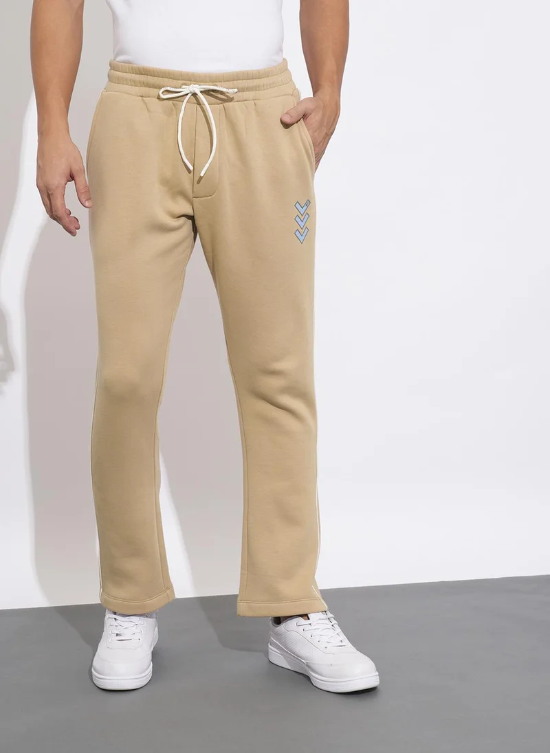 Being Human BEIGE Solid Men Mid-Rise Track Pants for Men | Best Price UAE