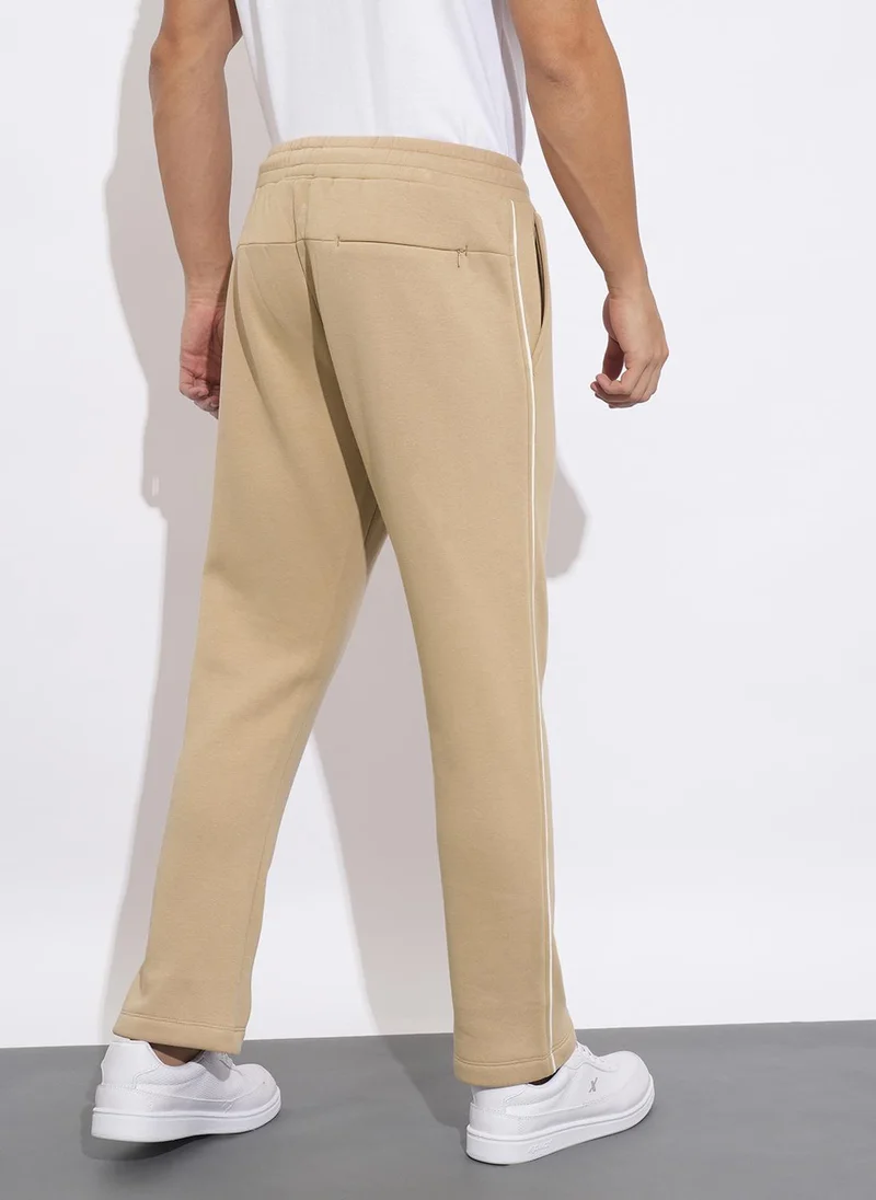 Being Human BEIGE Solid Men Mid-Rise Track Pants for Men | Best Price UAE