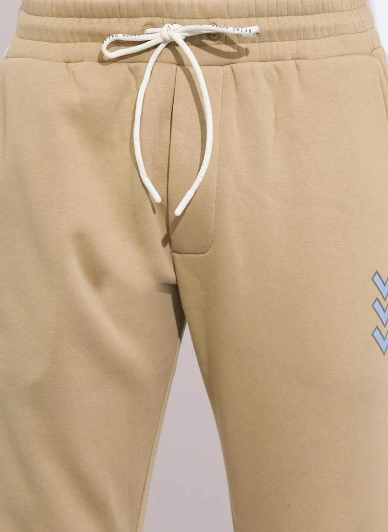Being Human BEIGE Solid Men Mid-Rise Track Pants for Men | Best Price UAE
