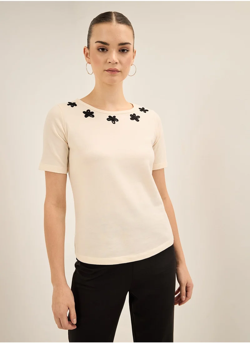 سولت اتاير Women's Elegant Off-White Round Neckline Top with Stylish Half Length Sleeves and Unique Applique Detail in Regular Fit Perfect for Effortless Everyday Fashion