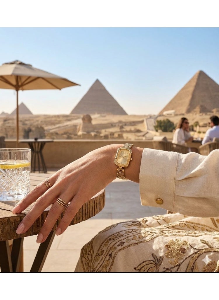 كالفن كلاين ساعة كالفن كلاين نسائية كلاسيكية مستطيلة بعقارب، ستانلس ستيل ذهبي بالكامل مع مينا بلون الشمبانيا - Image 2