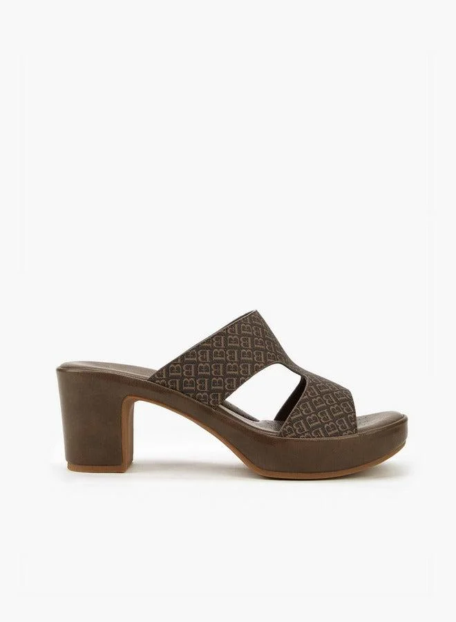 فلورا بيلا من شو إكسبرس صنادل بطبعات شعار وكعب مربع