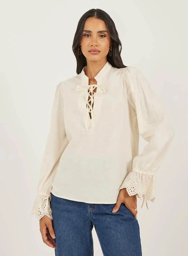 Styli Women Cream Solid Volume Sleeves Lace-Up Top