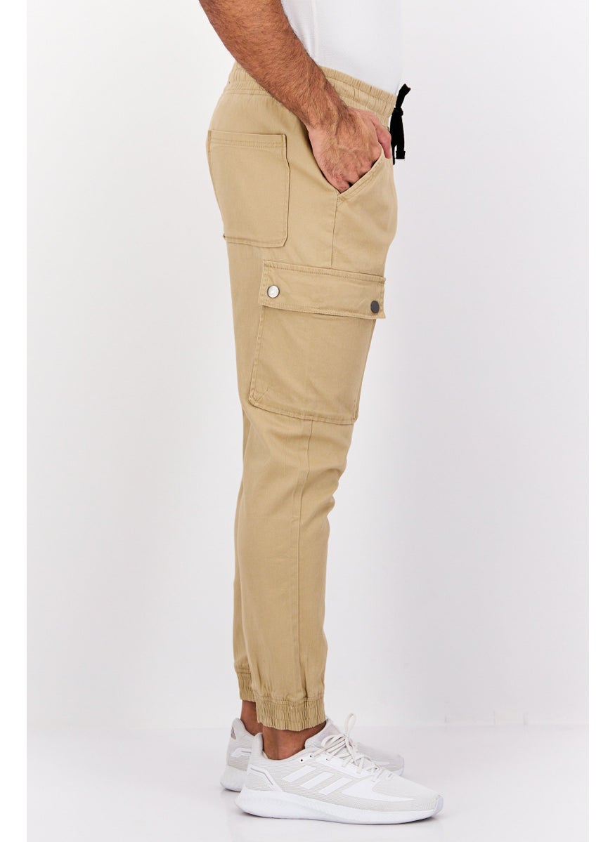 Men Regular Fit Drawstring Textured Cargo Pants, Khaki - pzsku/Z0359C314E61A55D249E2Z/45/_/1739801754/01adada3-5974-4f94-b1ed-6167aa6513ce