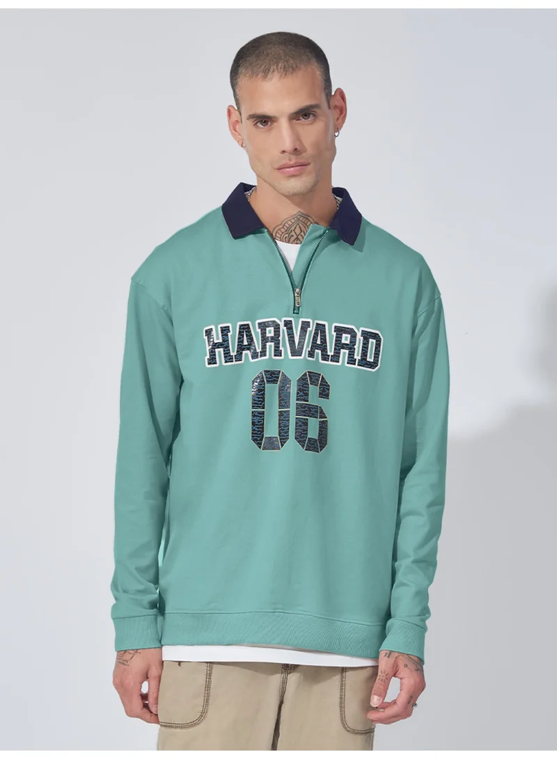 مانياك سويت شيرت قطن رجالي بياقة بولو مطبوعة بسحاب نصفي وأكمام طويلة بلون أخضر برلي