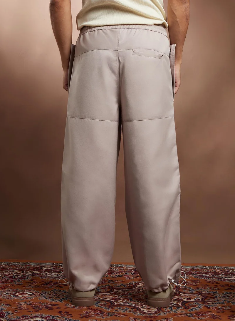 CAHOOT  Men's Saltbox Beige Panelled Parachute Trousers for Men | Best Price UAE