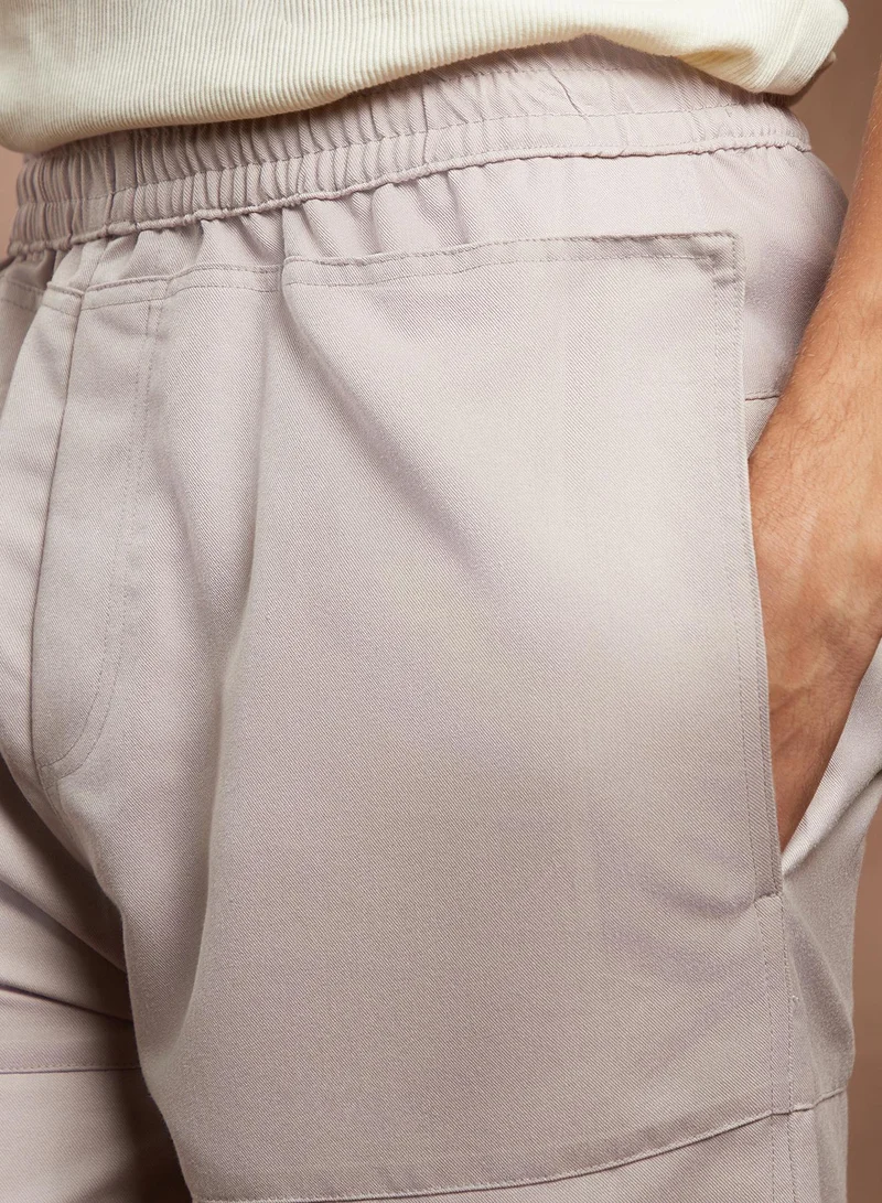 CAHOOT  Men's Saltbox Beige Panelled Parachute Trousers for Men | Best Price UAE