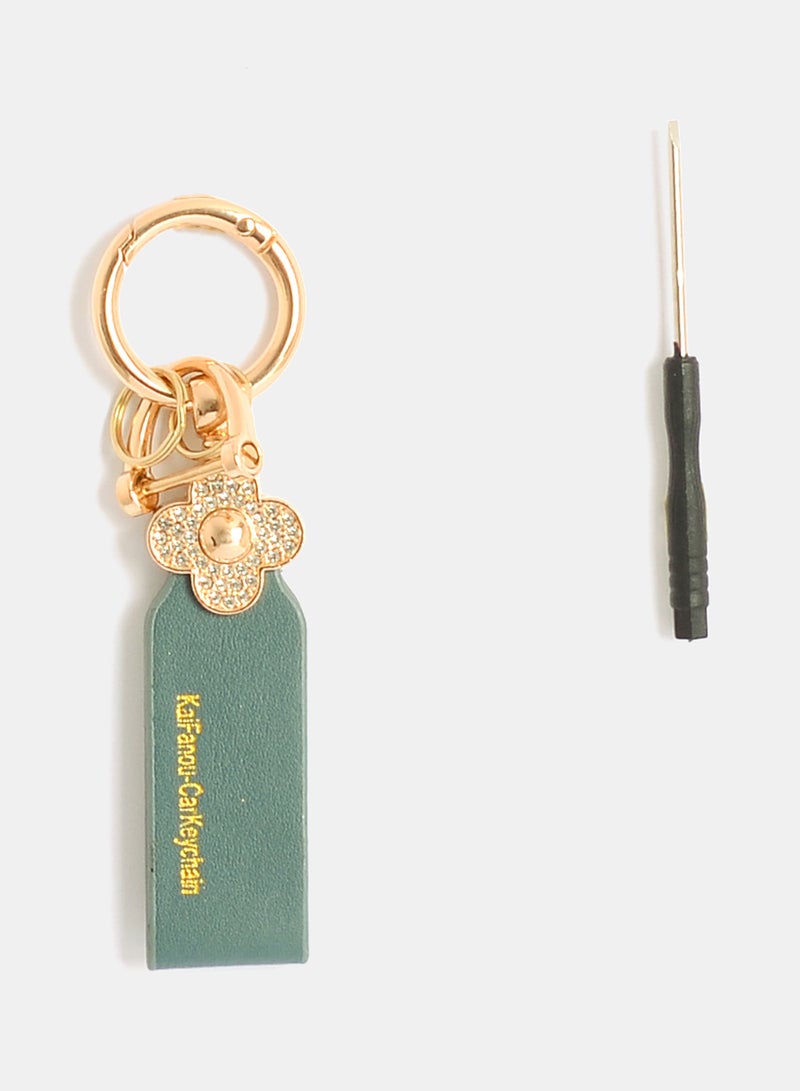 Akher el Ankoud A flower-shaped keychain, handbag charm, and pendant, all studded with zircon stones. - Image 1