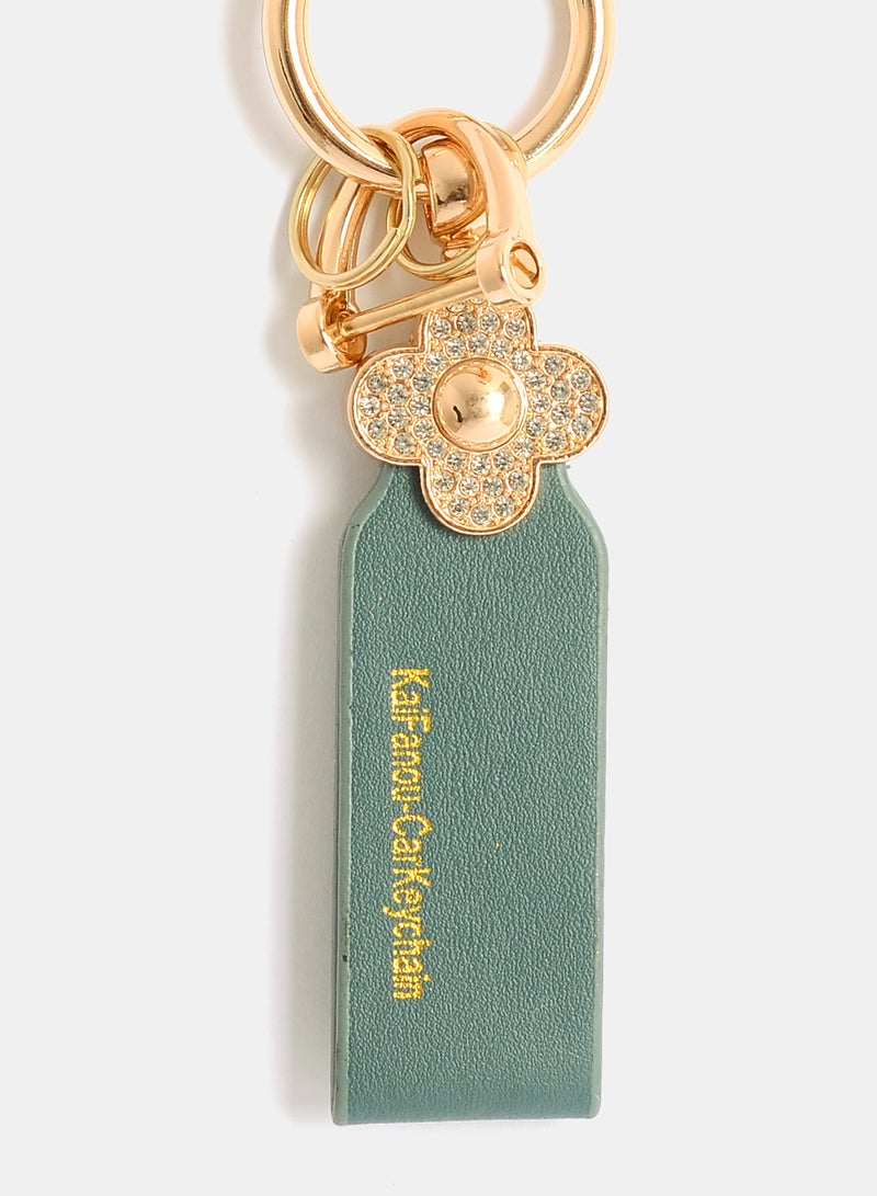 Akher el Ankoud A flower-shaped keychain, handbag charm, and pendant, all studded with zircon stones. - Image 2