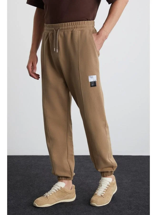 Grimelange Rowan Men's Relaxed Sherpa-Lined Front Quilted Decorative-Tagged Vizon Sweatpants.