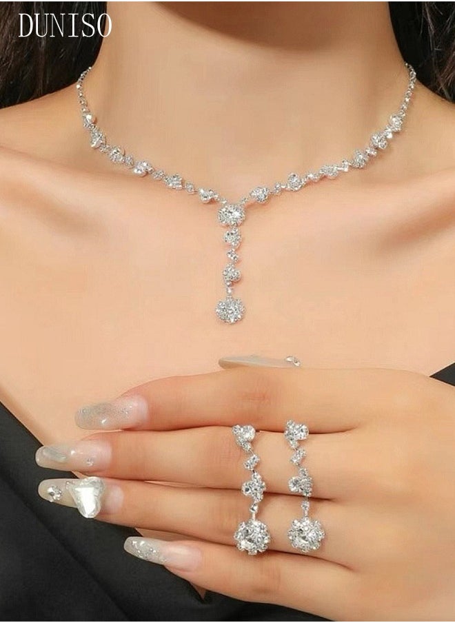 DUNISO مجموعة مجوهرات فضية من حجر الراين مكونة من 4 قطع للنساء لامعة ومحفظة مسائية ومحفظة بتصميم مموج وقلادة وأقراط وسوار للسيدات لحفلات العشاء وحفلات الزفاف  - Image 2