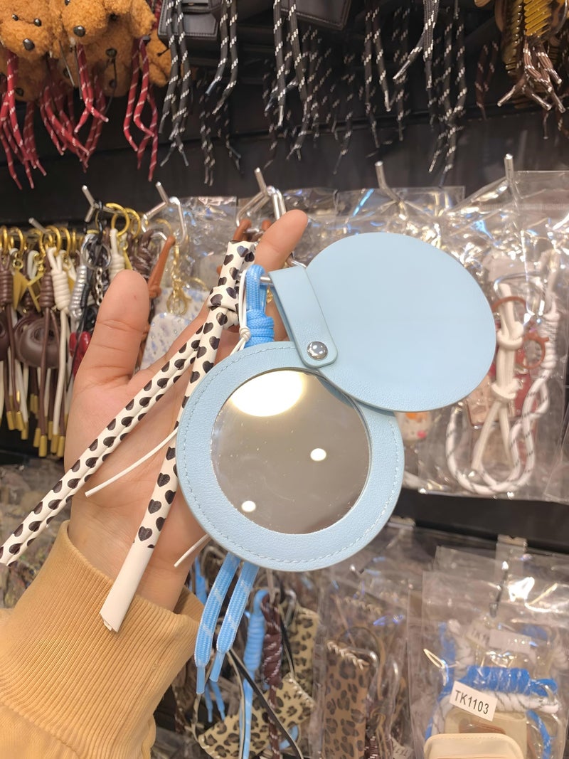 Leather - Stylish handheld mirror with ultra-clear glass surrounded by durable artificial leather frame and a snap closure guard ensuring long-lasting pristine condition. (option 1) - Image 2
