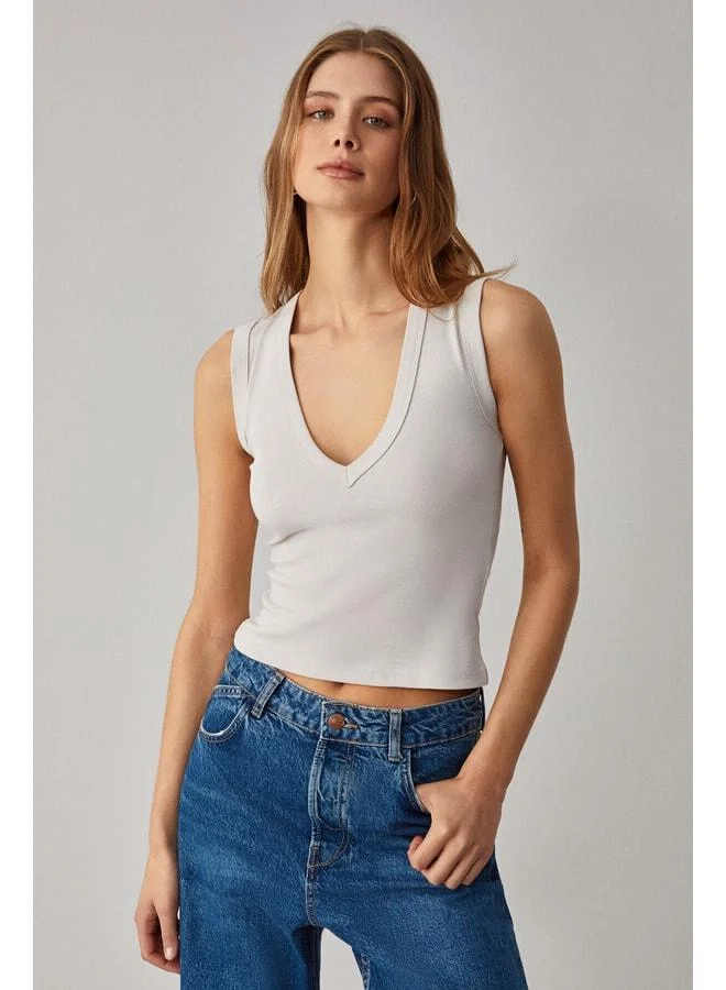 GRIMELANGE Lescosa Women's Slim V-Neck Sleeveless Stone Color Blouse.