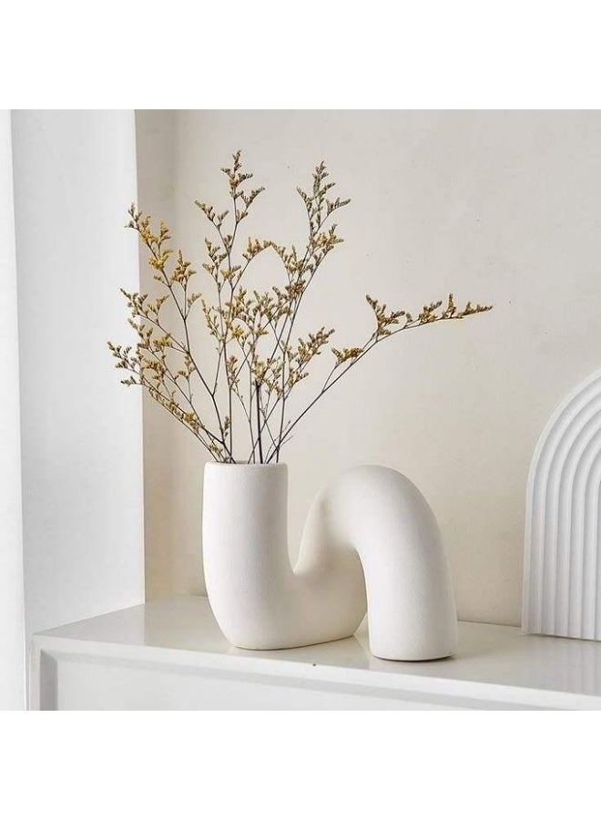 The white slanted vase, a piece that combines softness and boldness in one unique design.