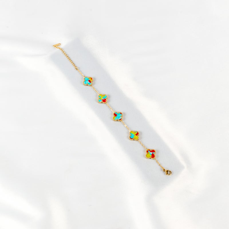 ذا بلاك بيرل اكسسوريز أنسيال أستانليس ستيل ذهبي مع شكل زهرة البرسيم بألوان خلابة - Image 1