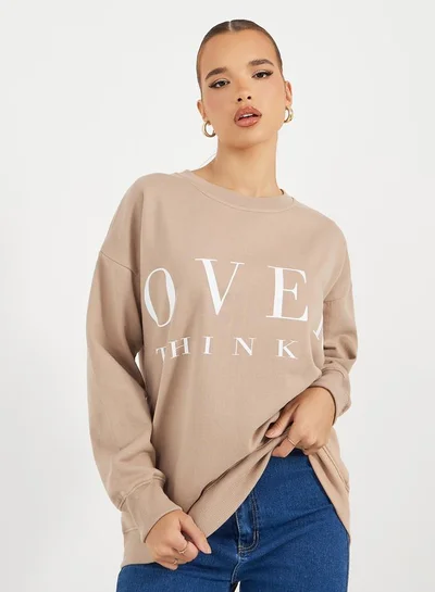 Styli Oversized Longline Slogan Sweatshirt
