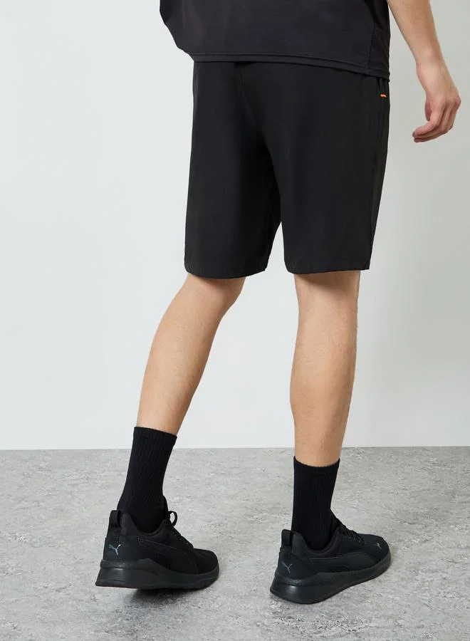 Styli Active  Men Reflector Print Training Shorts with Zipper Pocket for Men | Best Price UAE