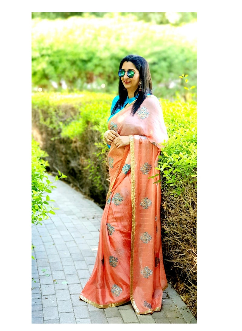 Grab Mantra - Light Orange Color Chinon Silk Saree with Turquoise Blue Flower Embroidery All Over And Satin BlueUnstitched Blouse - Image 1