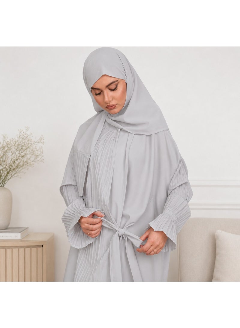 Women's prayer garment featuring an open front with a tie closure and a loose, comfortable fit; designed with soft, pleated sleeves and made from lightweight fabric suitable for prayer, Umrah, Hajj, and daily use.