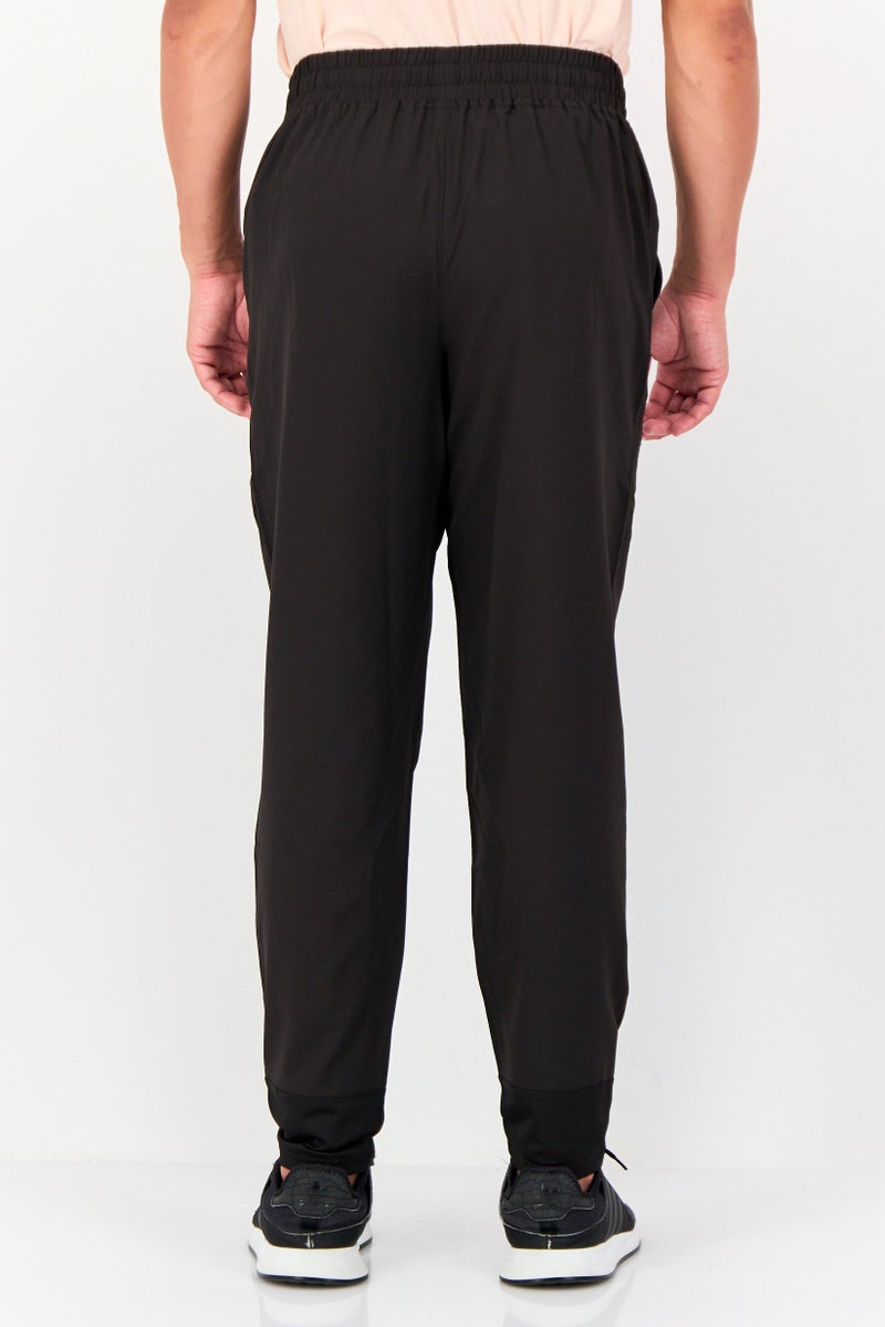 PUMA سروال رياضي للرجال بتصميم ملائم بشعار العلامة التجارية، أسود - Image 4