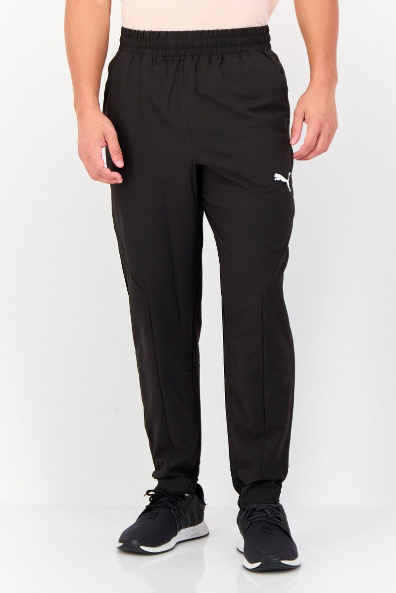 PUMA سروال رياضي للرجال بتصميم ملائم بشعار العلامة التجارية، أسود - Image 1