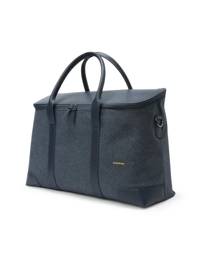 Mokobara The Cabin Duffle | Vegan Leather Water Resistant Cross Body Travel Bag for Men and Women with 15" Laptop Compartment | Blue Messenger Bag (Tailored Blue)