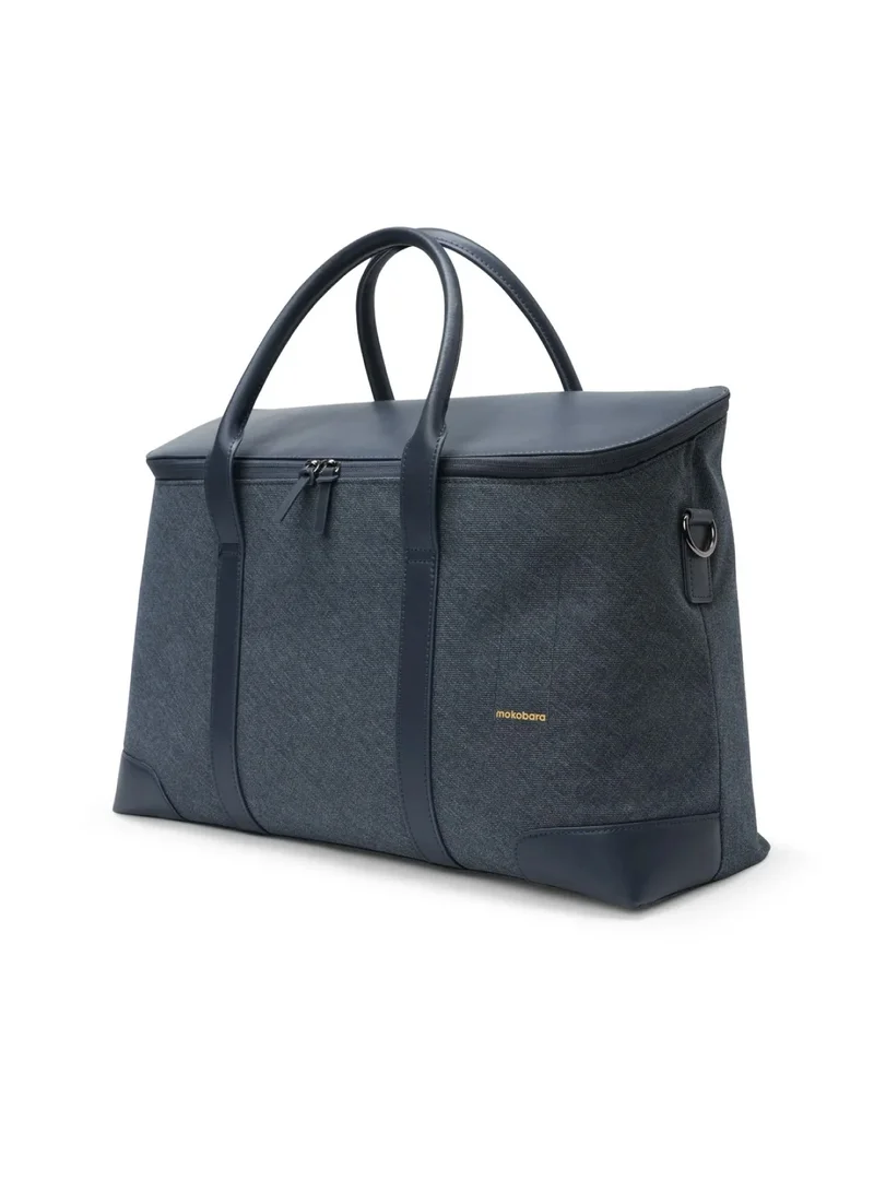 موكوبارا للتجارة ذ.م.م The Cabin Duffle | Vegan Leather Water Resistant Cross Body Travel Bag for Men and Women with 16" Laptop Compartment | Blue Messenger Bag (Tailored Blue)