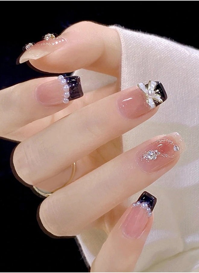 NIBEMINENT 24Pcs Fake Nails, Press Nails In Box,Short-length Flat head shaped Solid Black Color Shiny Nail Art,Bow knot Pearl Zircon,Chanel style,Fake Nail Patch  - Image 1
