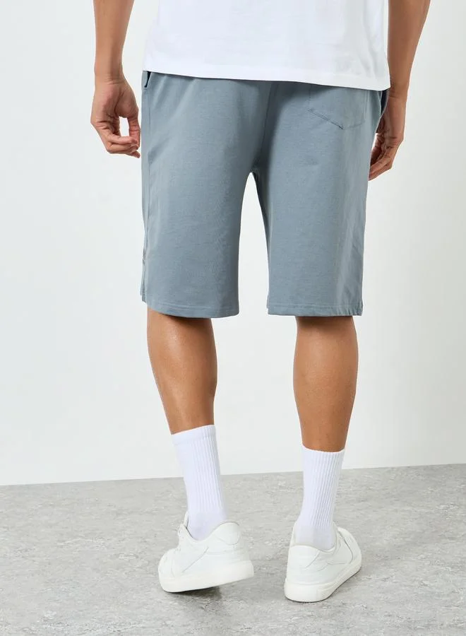 Styli  Men Blue Placement Printed Oversized Shorts for Men | Best Price UAE