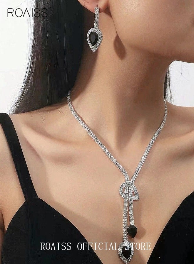 رويس طقم مجوهرات نسائي من قطعتين، أقراط متدلية وقلادة مزينة بأحجار الراين. طقم أقراط وقلادة بسيط. قلادة زفاف ومساء وحفلات على شكل سلسلة، فضية/سوداء - Image 1