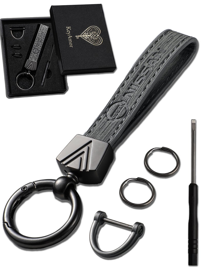 KeyAmor Elegant grey metal and leather keychain with NISSAN logo  featuring 3 key rings perfect as a fancy gift or car accessory designed in sleek grey for a modern look offers 360 degree rotation for convenience suitable for both men and women and comes in a fancy gift box - Image 1