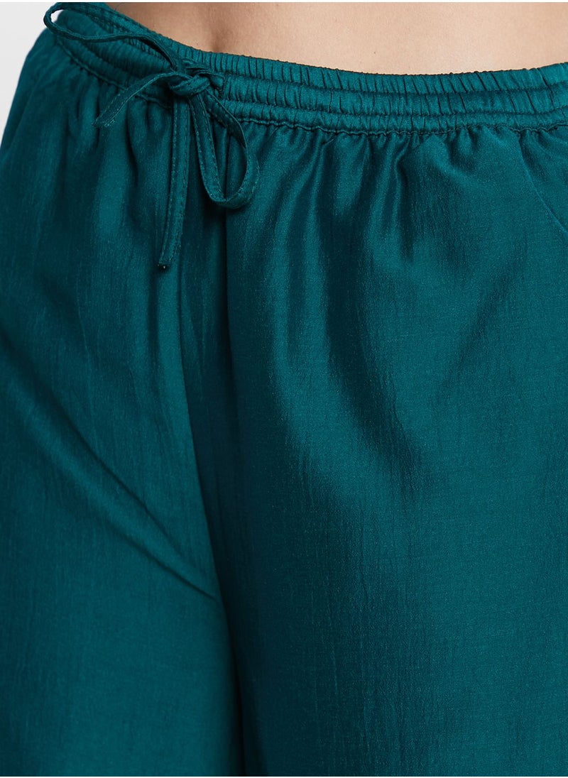indya - Border Printed Flared Palazzo Pants - Image 1