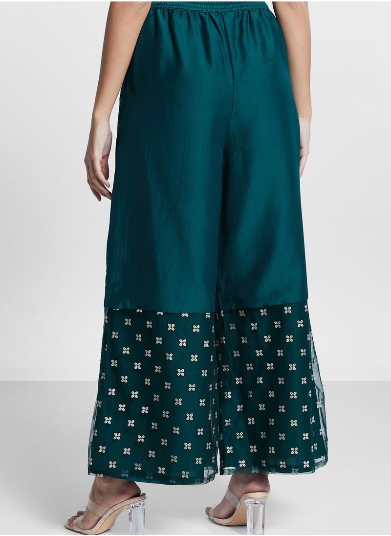 indya - Border Printed Flared Palazzo Pants - Image 1