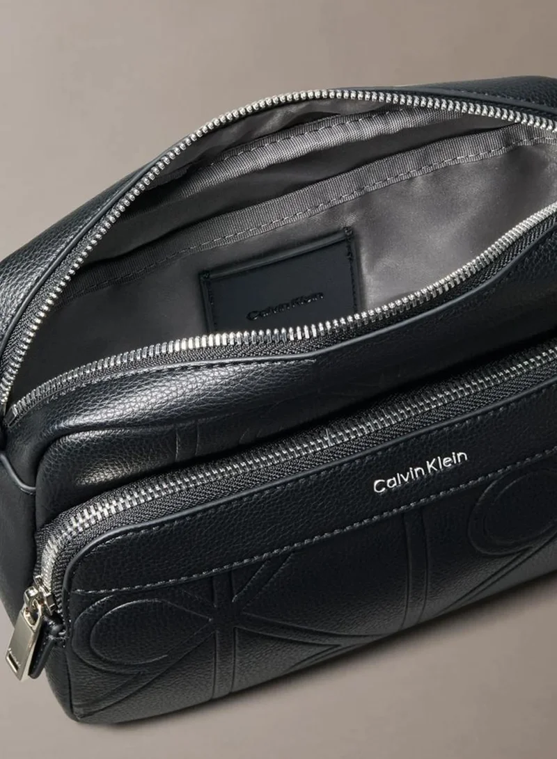 Calvin Klein Black Allover Embossed Emblem Logo Camera Bag for Men | Best Price UAE