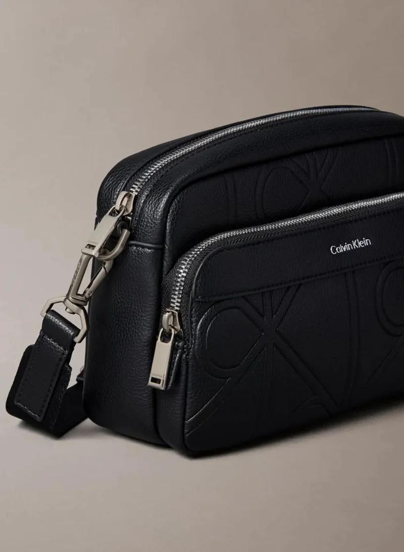 Calvin Klein Black Allover Embossed Emblem Logo Camera Bag for Men | Best Price UAE